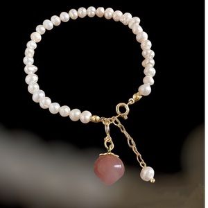Natural Pearl bracelet with peach pink charm